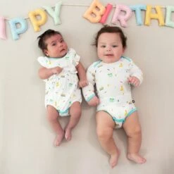 Long Sleeve Bodysuit In Cloud Party -Kyte Baby kyte baby long sleeve bodysuits long sleeve bodysuit in cloud party 32605491560559